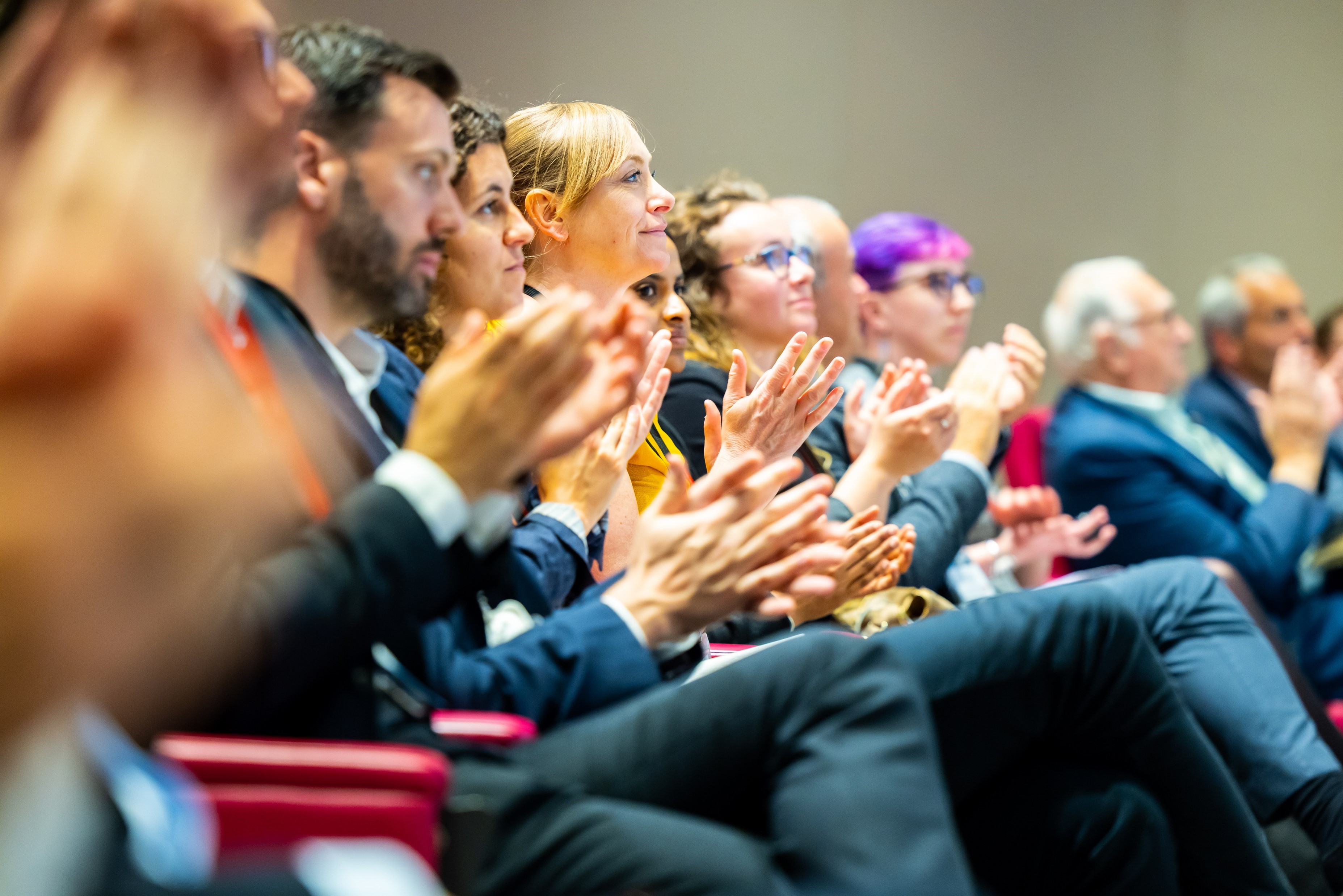 Audience applauding at joint event