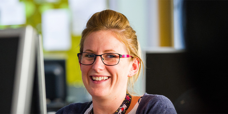 Close up of advisor smiling in an office environment 