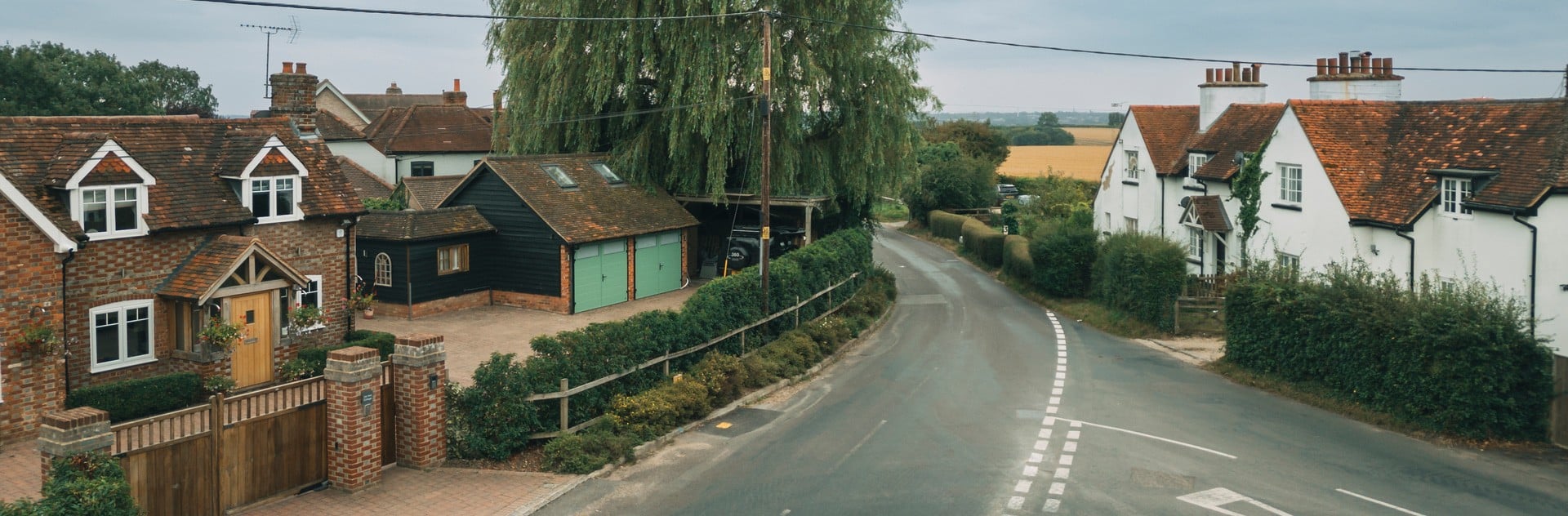 Picture of residential area with road in the middle.