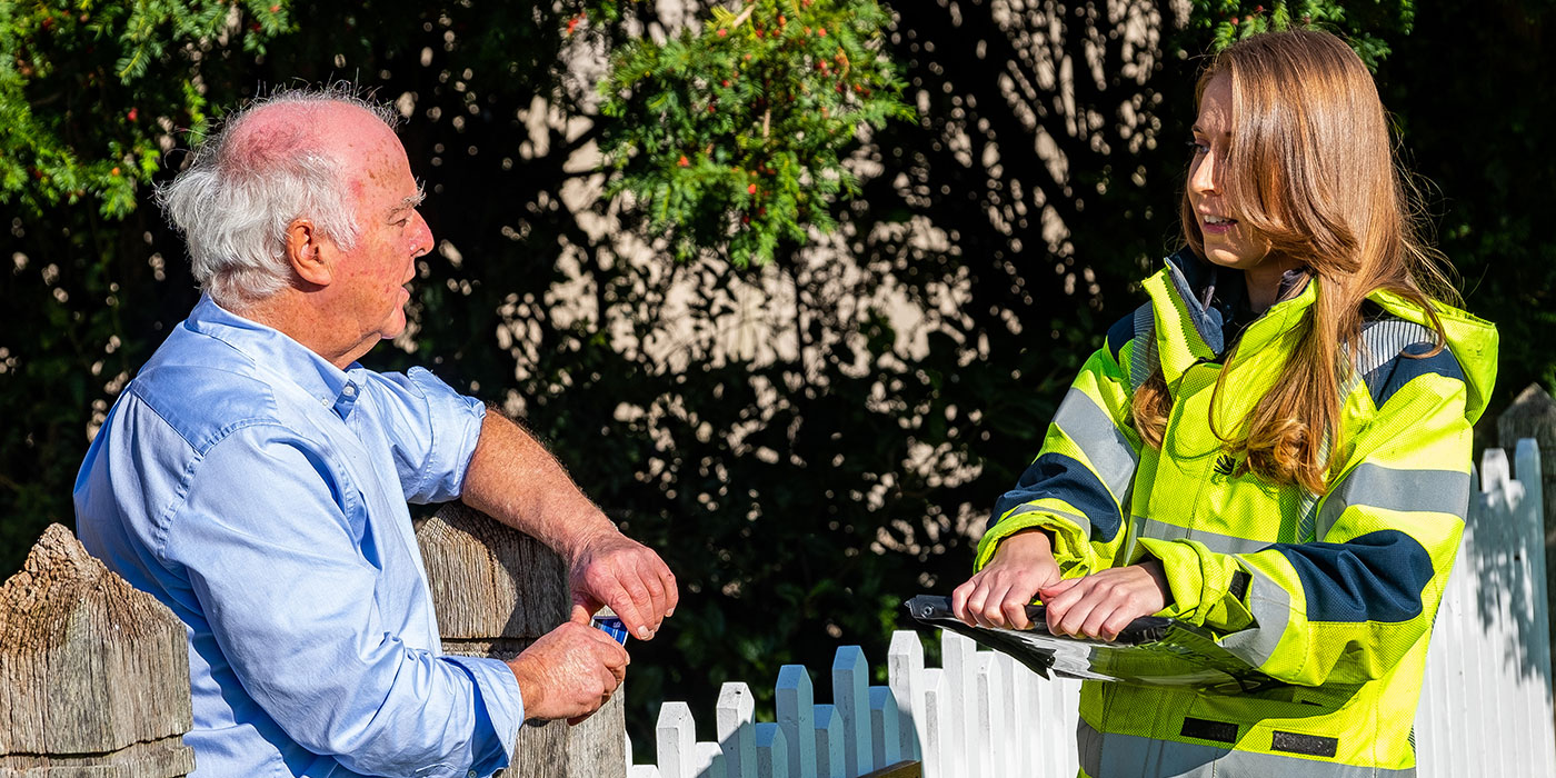 SSEN advisor speaking with customer in his garden