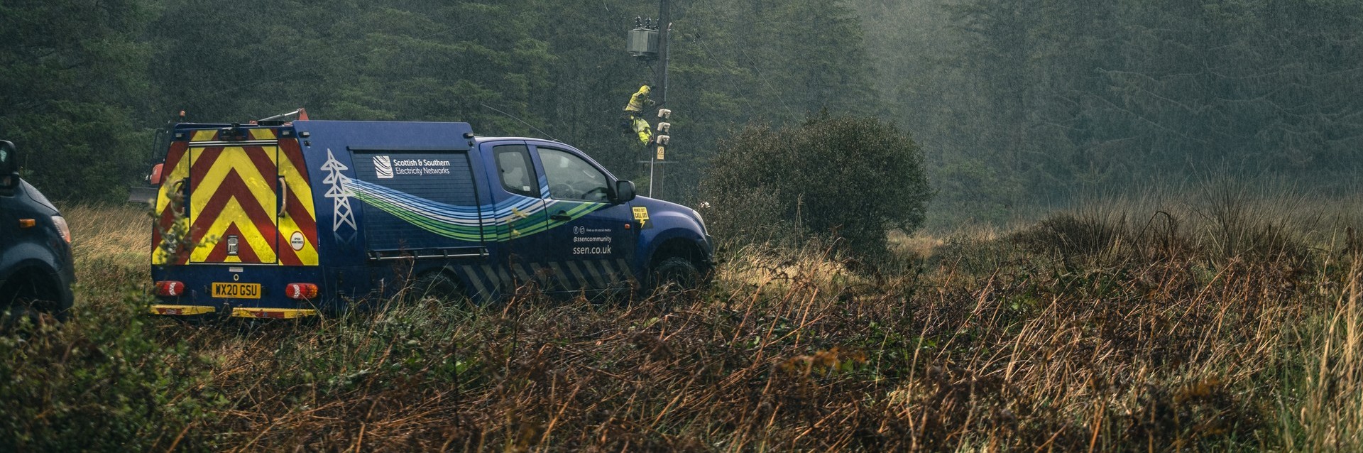 SSEN Van with green trees in background.